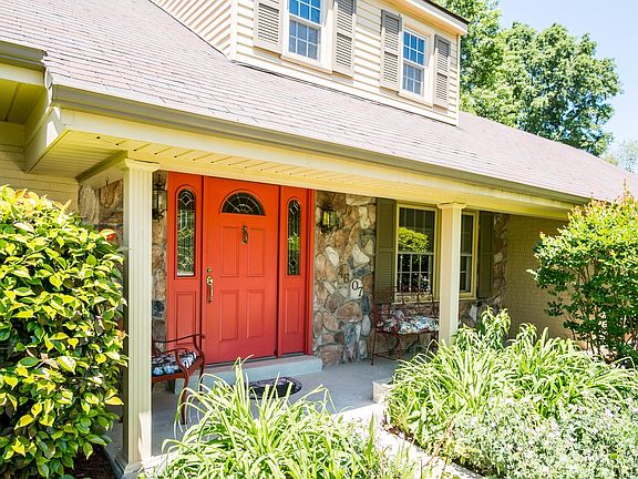Charming front porch with stone accent wall
