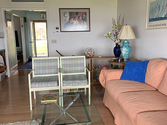 Family room with wood burning fireplace.