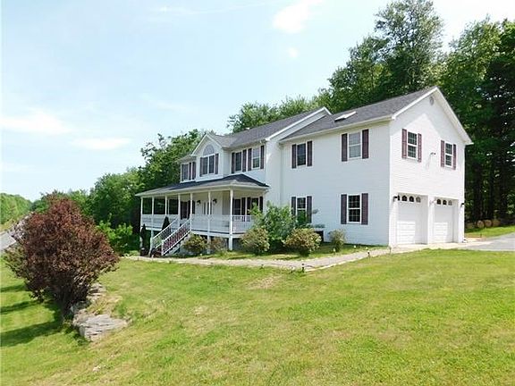 Surrounded by lush landscaping.