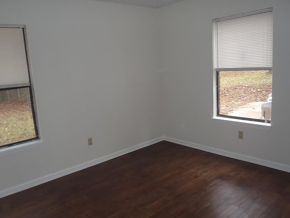 Bedroom showing vinyl plank flooring that runs throughout the unit.