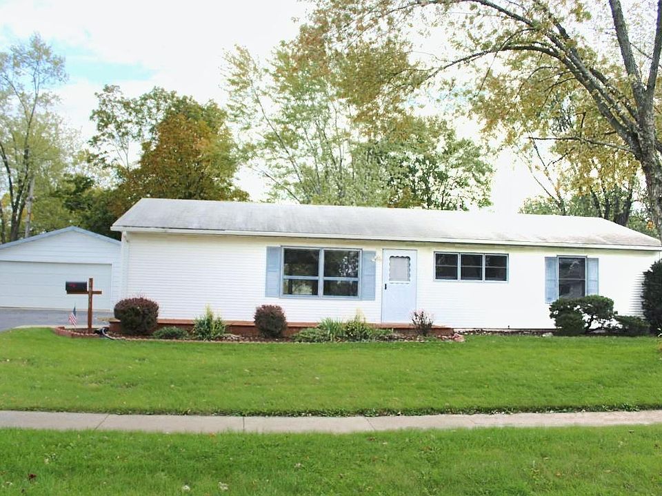 Front of house with beautiful wood deck