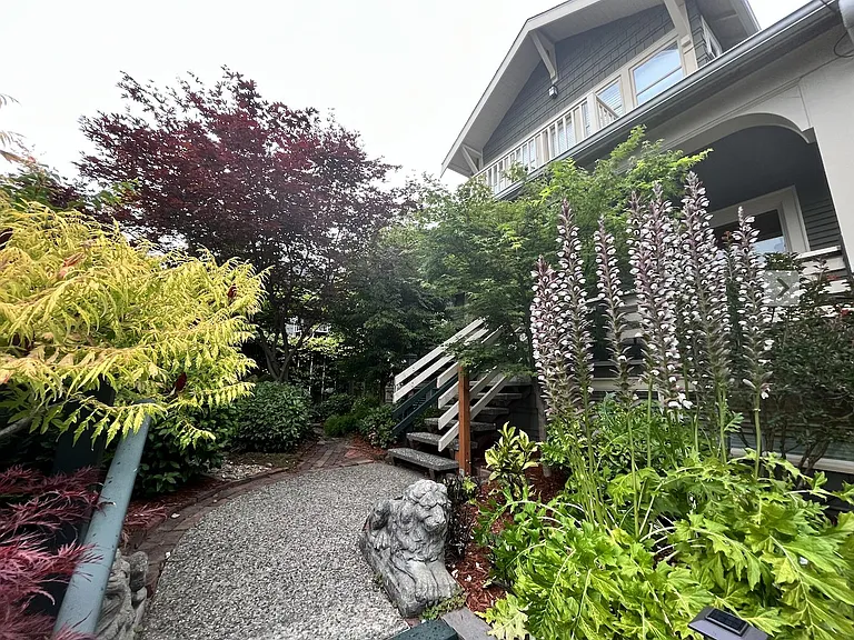 The front garden area is beautifully lush & private