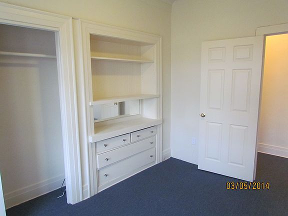 Bedroom 1 with built-in cabinetry