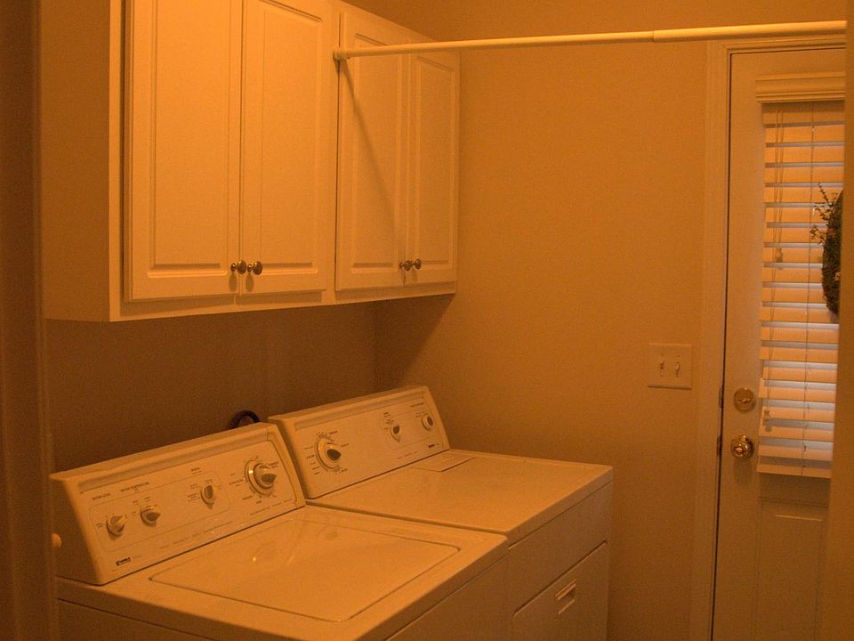 Laundry with covered cabinets