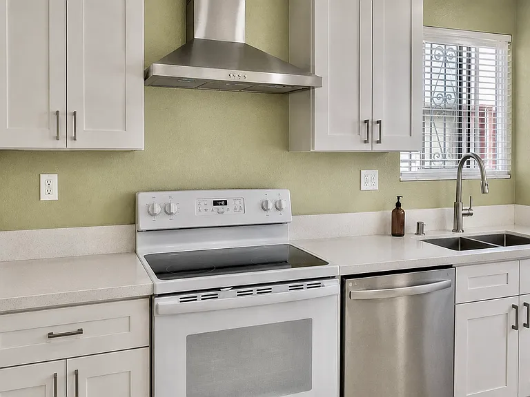 BRAND NEW remodeled kitchen, new countertops, cabinets, sink, faucet, blinds and appliances
