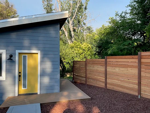Privacy fence between main house