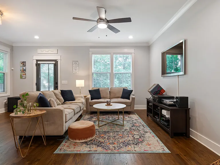 Sofa and love seat, coffee table, area rug and console to remain