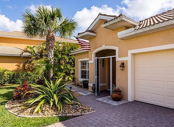 Front Entrance with Landscaping and Night Lighting