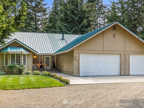 So many great elements with this charming home, the metal roof, the covered front porch, the cement apron in front of the garage, the pristine yard and flower beds.  This home is ready for you to come take the reins and continue this well established property.