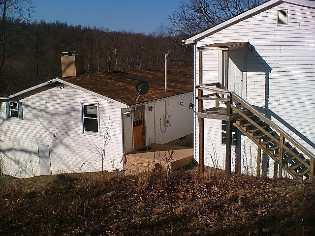 from back yard view garage on right with finished room upstairs