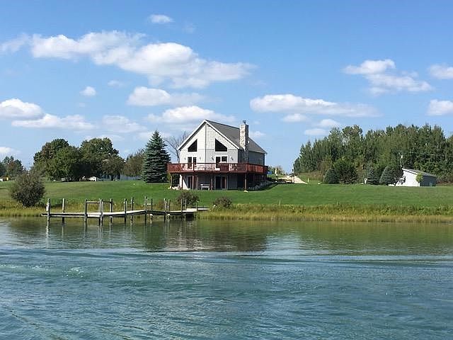 Home and pole barn from river