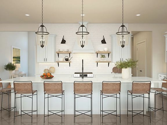 Kitchen with pendant lighting and floating shelves