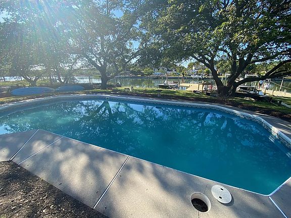 Saltwater pool with shallow and deep end overlooking the Lynnhaven River and your boat docks.
