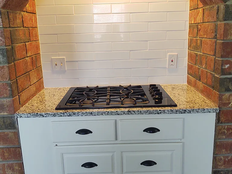 Nice drawer space under stove. Built in oven is to the left. Pantry to the right of stove.
