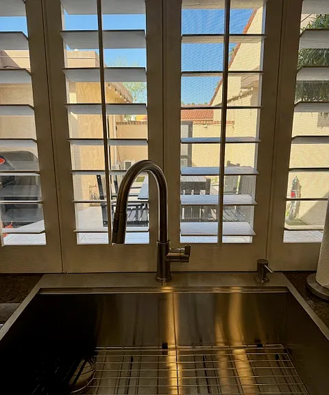 View from kitchen window out to courtyard.