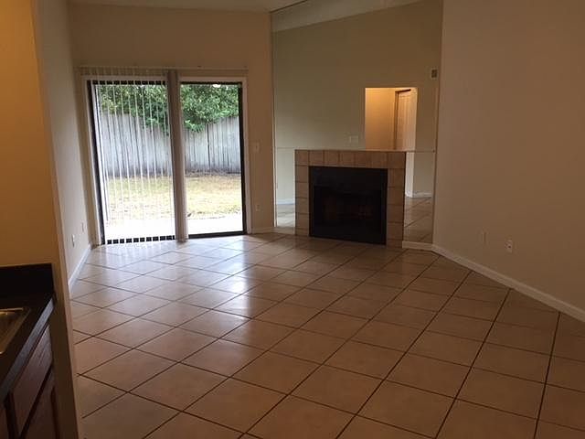 Living room with vaulted ceilings, fireplace, wet bar and sl
