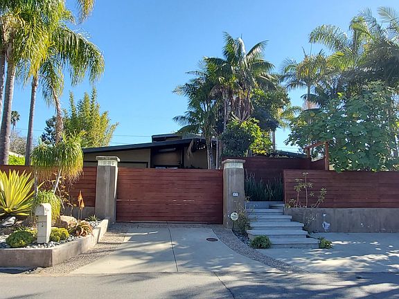 Security and privacy are assured by the 6' electric gate. The walk-up entry is to the right.