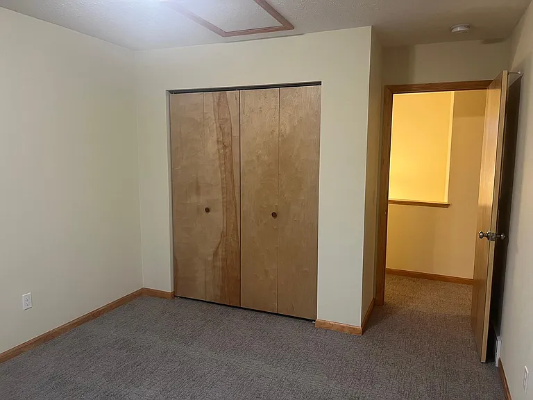 One of two upper level bedrooms.