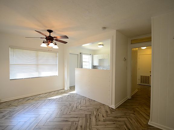 Large dining area is light-filled and is open to the kitchen