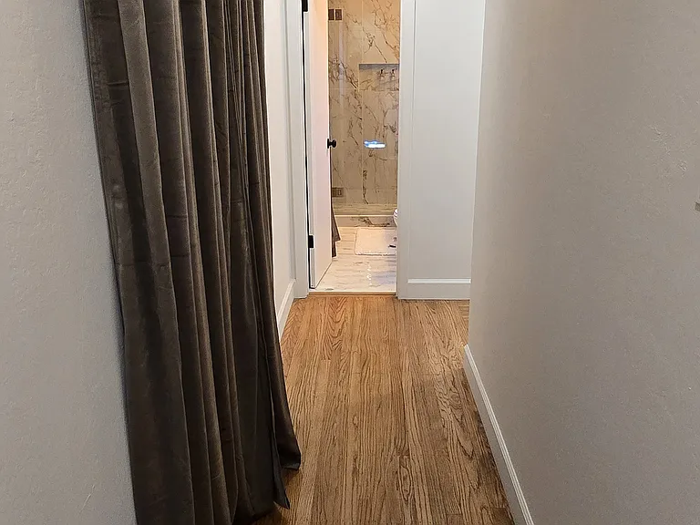 Hallway with recessed lighting.