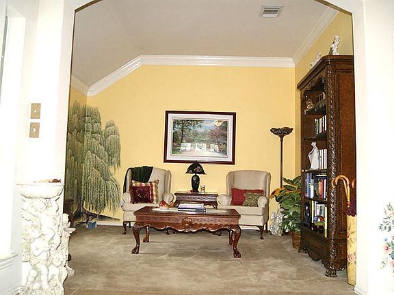 To your left entering you will have a formal living room.