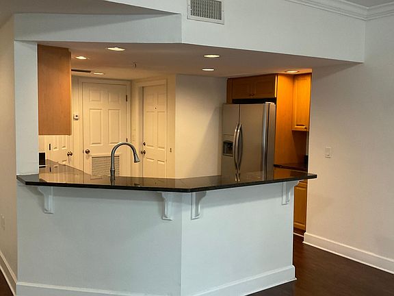 Large kitchen with granite, stainless steel appliances, large pantry