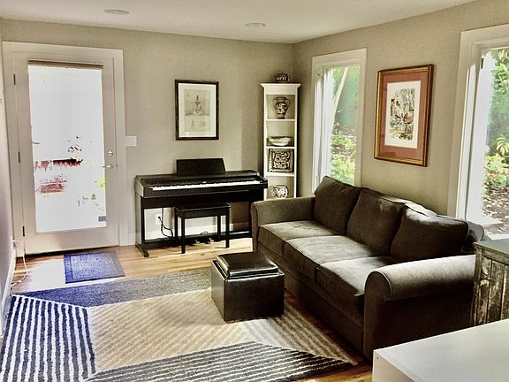The apartment is unfurnished but the previous tenant enjoyed playing piano, watching TV on a large couch in a light filled open-concept living room.