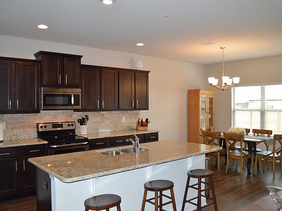 Spacious kitchen with plenty of cabinets.