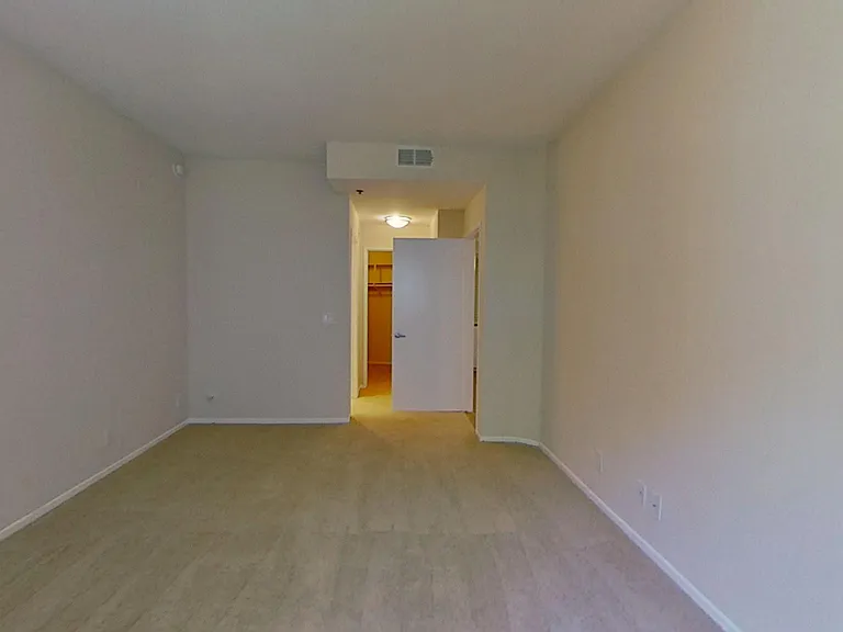 Primary bedroom of apartment #213