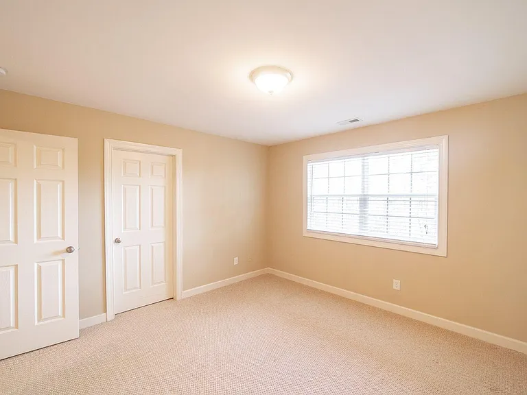 2 OF 2 GUEST BEDROOMS WITH A WALK-IN CLOSET