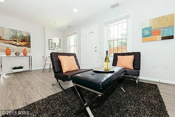 Main, open living space. Couch is in front of fireplace.