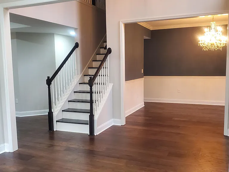 Stairs and formal dining room