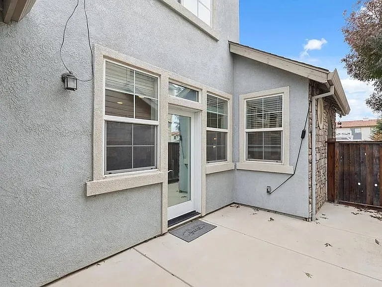 Side yard with entry into living and dining area