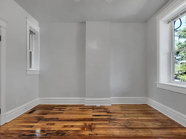 Bedroom 2 - salvaged hardwood floors, ceiling fan, venetian blinds, closet