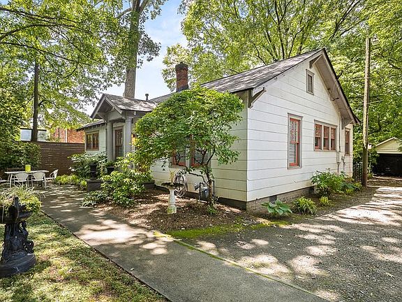 Side of the house with parking for 2 cars in driveway