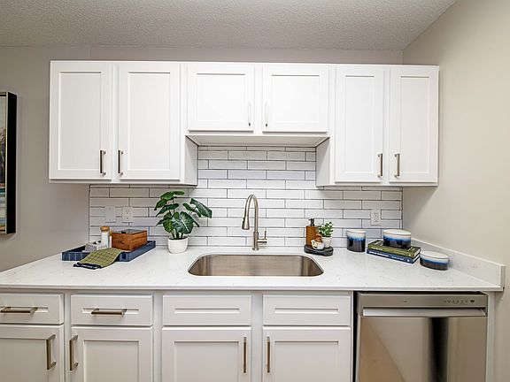 Kitchen with granite counters and modern cabinetry