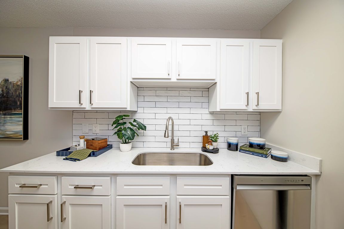 Kitchen with granite counters and modern cabinetry
