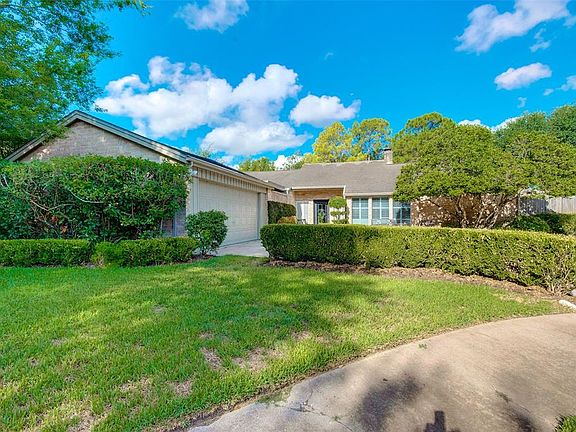 Street view of the home. The simple brick exterior doesn't betray what awaits inside - a great floor plan, vaulted ceilings and lots of windows with natural light streaming in to brighten any day.