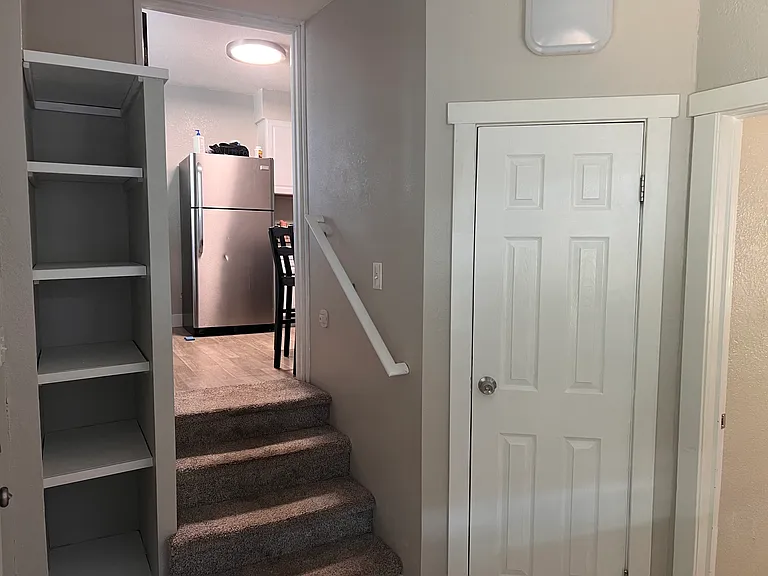 Private guest/office wing with separate entrance, mudroom storage, 3rd bed, and 2nd bath. Closes for privacy.