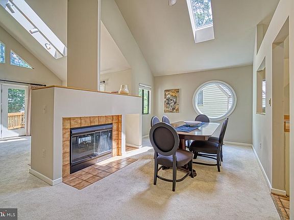 Dining Room With Two Sided Fireplace, Skylights