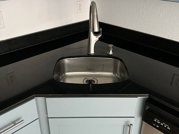 Updated stainless steel hardware and dishwasher.