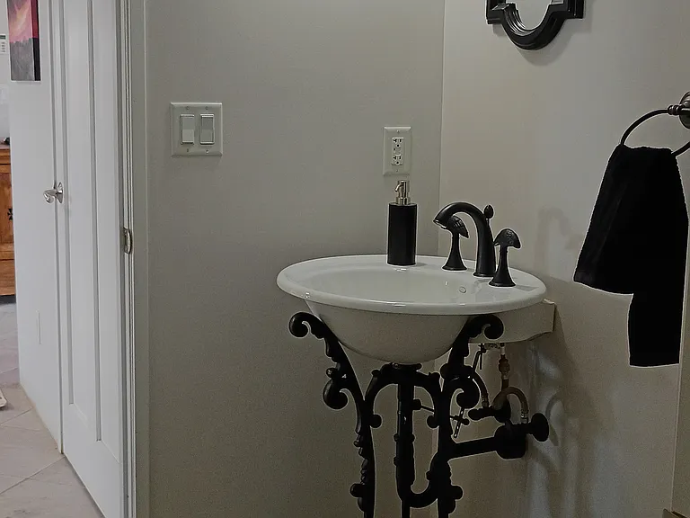 The half-bathroom from the door leading to the laundry room.