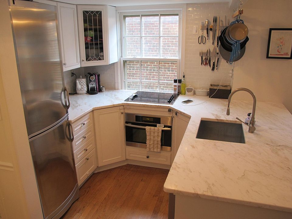 Kitchen showing two lazy Susans (one on each side of the oven). The oven is a microwave, convection, and conventional oven by Miele.