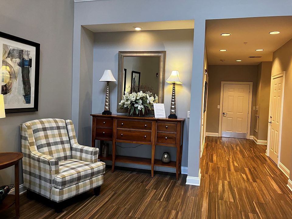 Condo building entrance and hallway to the elevator