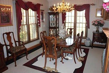 The Dining Room is open to the Kitchen and Great Room with beautiful built-ins
