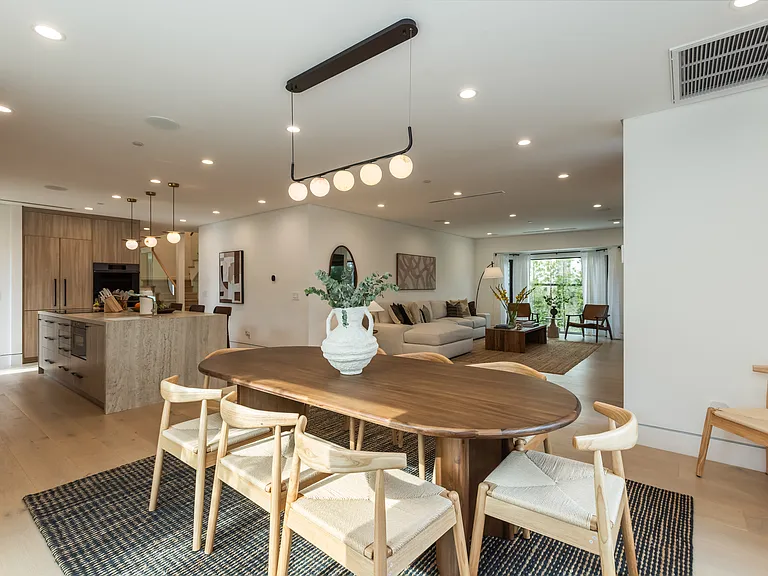 The dinning room is an open floor concept, with floor to ceiling windows and easy access to the kitchen.
