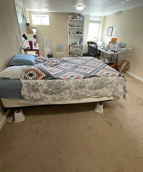 very large bed room area. "Desk" is an 8' table with lots of room left. Big windows