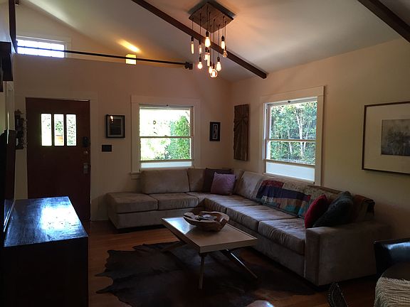 High vaulted ceilings in the living room w/small loft