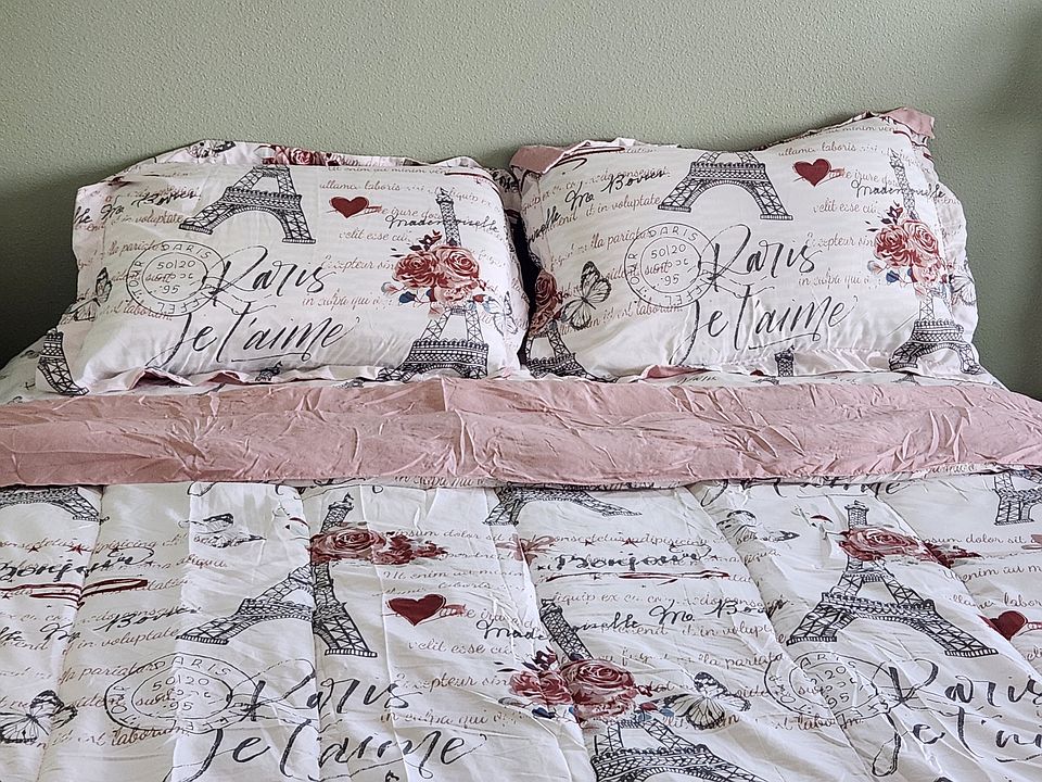 Comfortable bed with new bedding, Sheets, pillow casses and conforter.