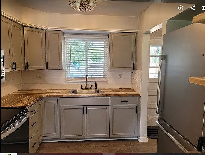 New gray cabinets,custom butcher block countertops,shiplap backsplash